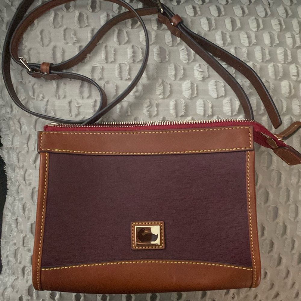 Dooney and Bourke purse. Length 8 1/2”